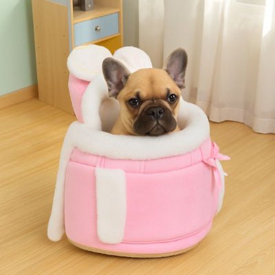 Sac a dos chien rose avec intérieur blanc, bouledogue français confortablement installé.
