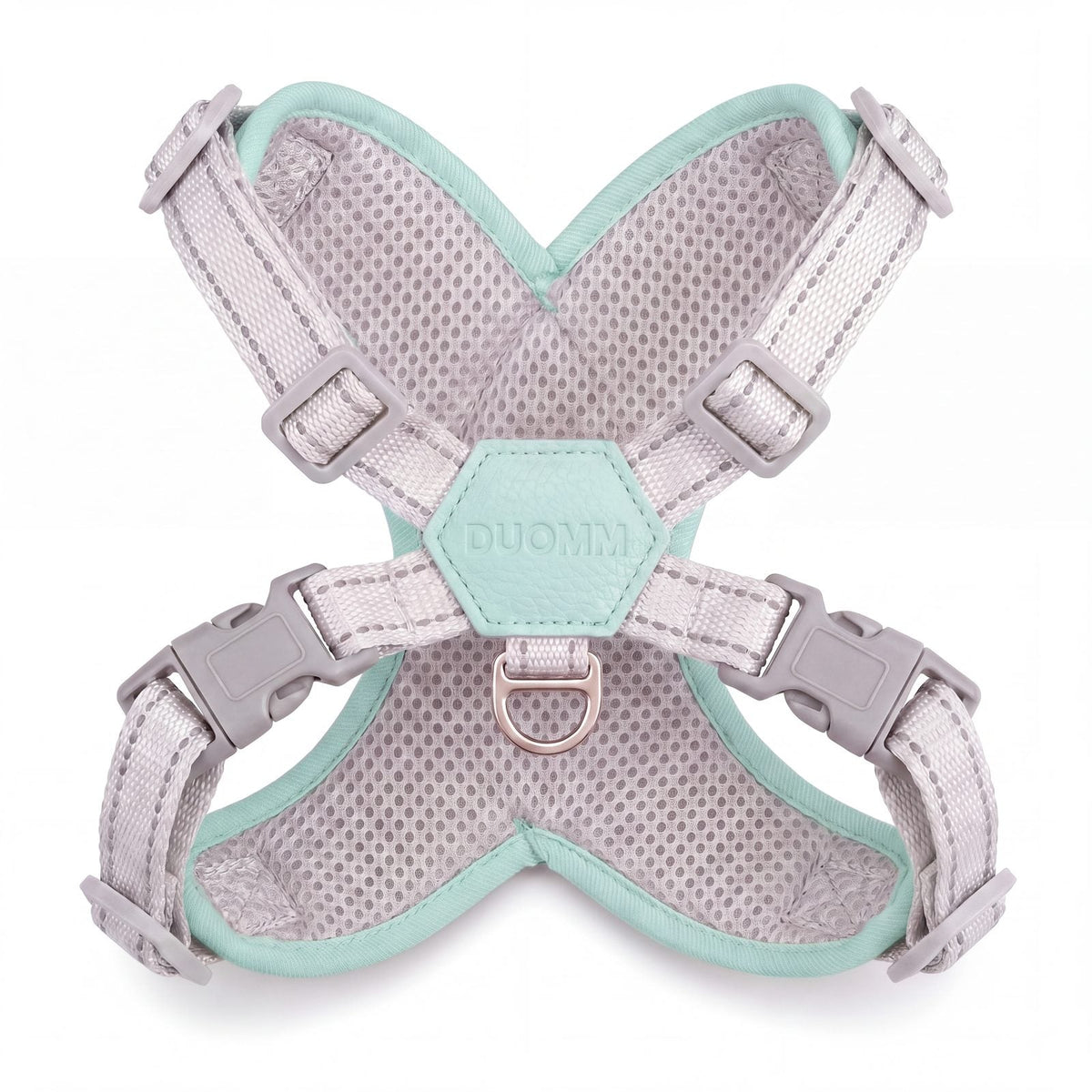 Harnais croisé vert menthe vu de l'intérieur sur fond blanc, avec la maille alvéolée grise respirante, le patch hexagonal et l'anneau en D
