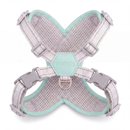 Harnais croisé vert menthe vu de l'intérieur sur fond blanc, avec la maille alvéolée grise respirante, le patch hexagonal et l'anneau en D