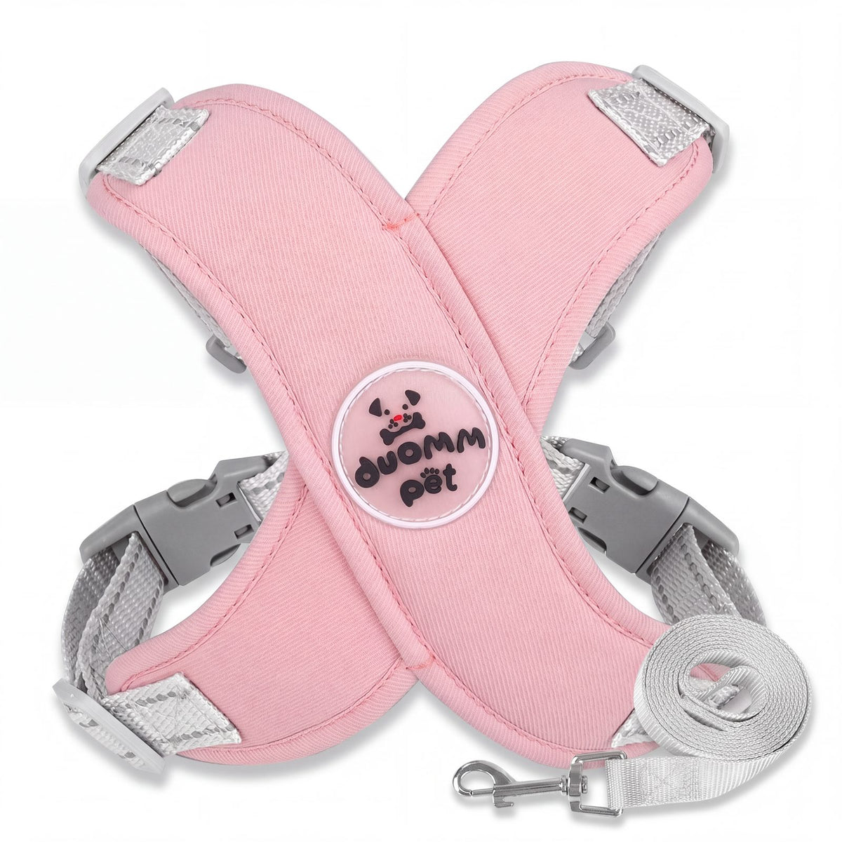 Harnais petit chien croisé en X rose avec laisse grise assortie, packshot sur fond blanc