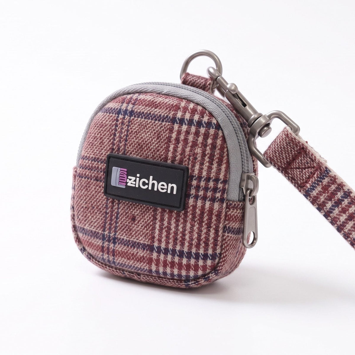 Laisse assortie au harnais petit chien tartan bordeaux, enroulée sur fond blanc