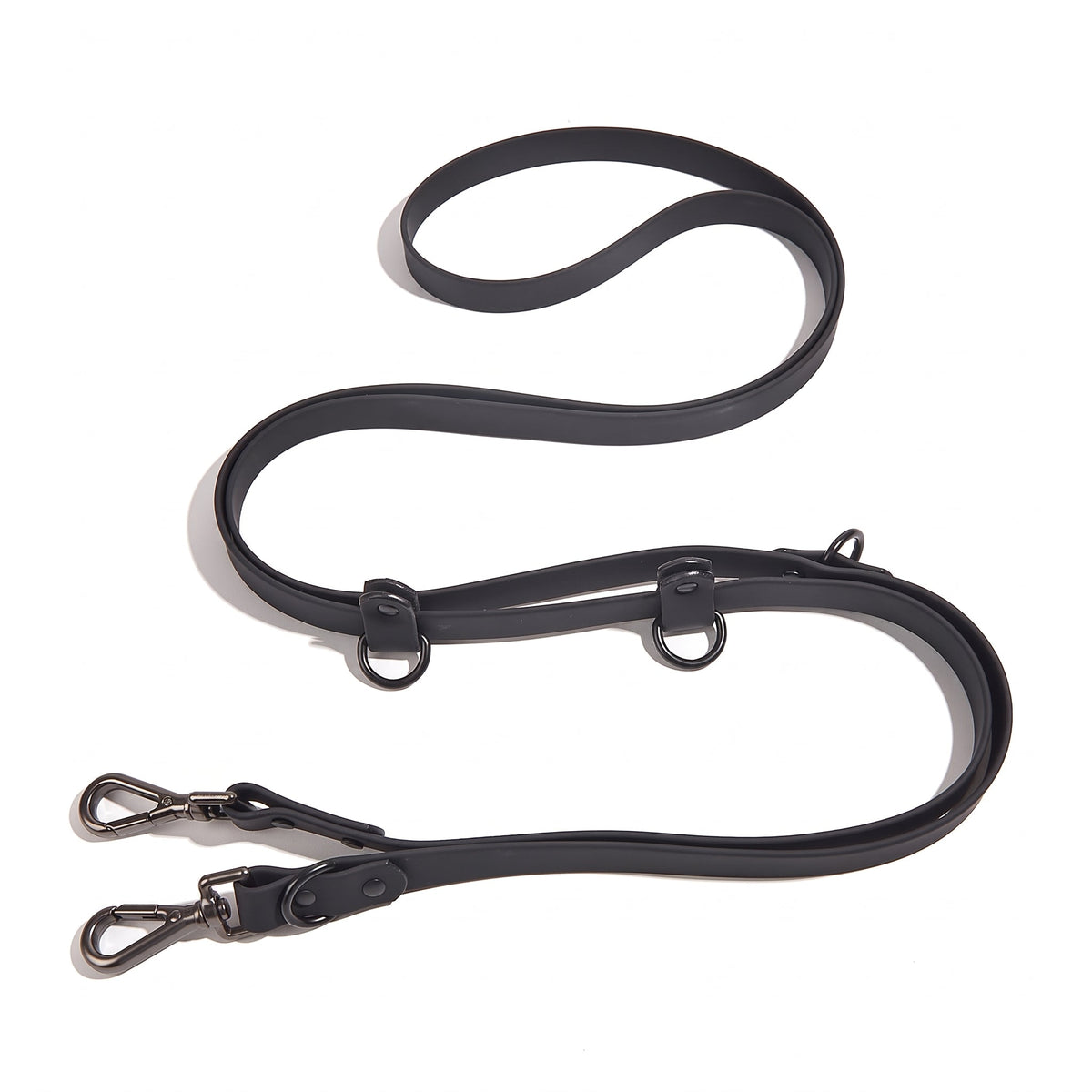 Laisse pour chien main libre multi-tâches en PVC noir, présentée à plat