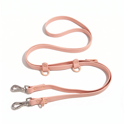 Laisse pour chien main libre multi-tâches en PVC rose, présentée à plat