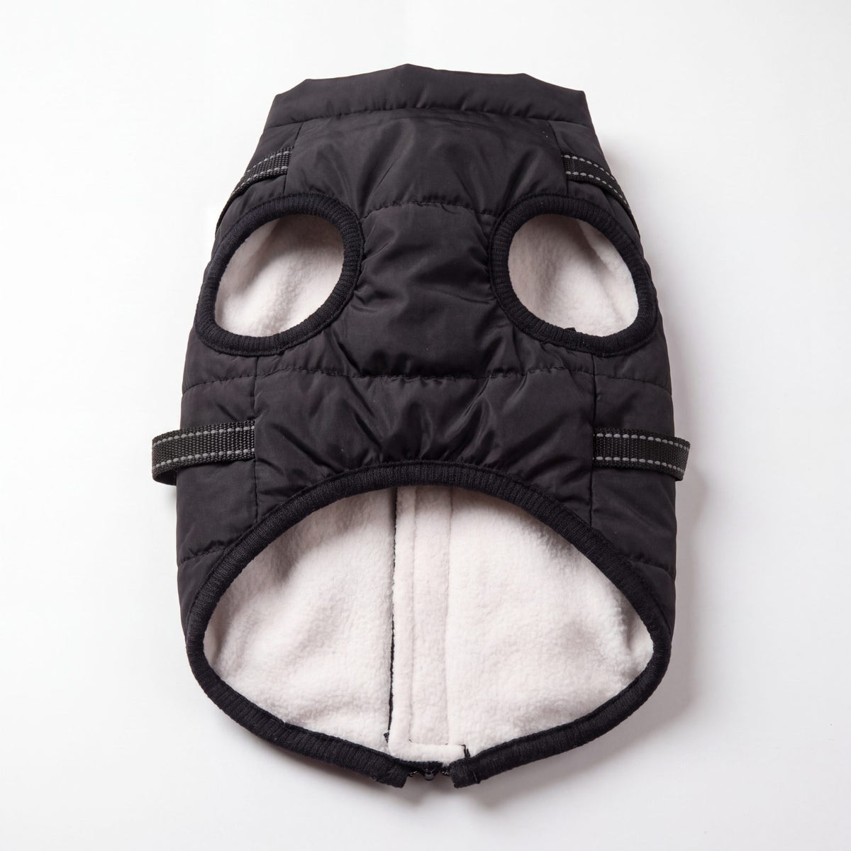 Intérieur doublé polaire blanc du manteau pour chien noir, vue à plat